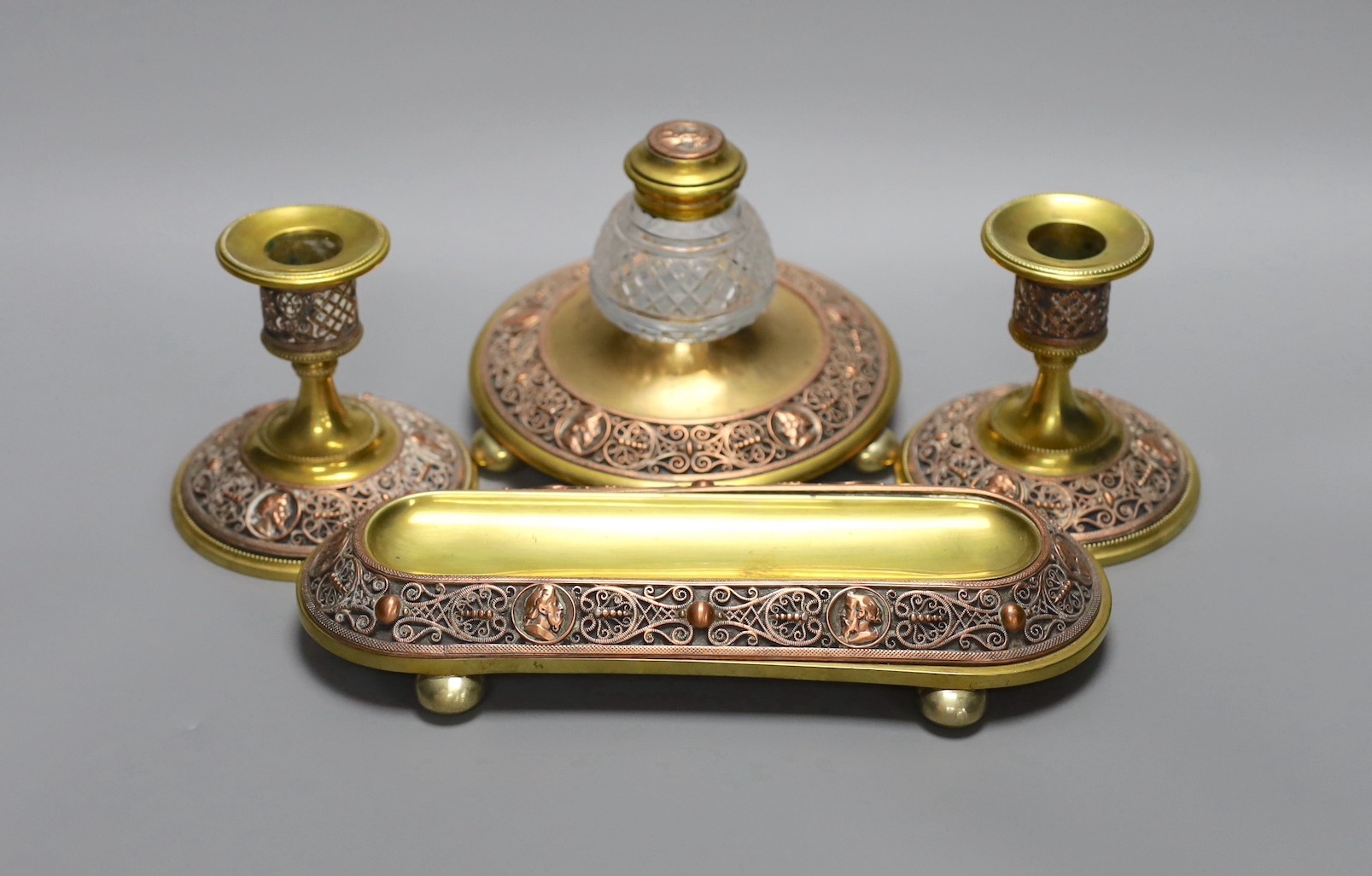 A 19th century brass and copper filigree desk set, 23cm